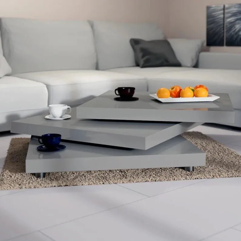 Table basse Orvyn à plateaux pivotants